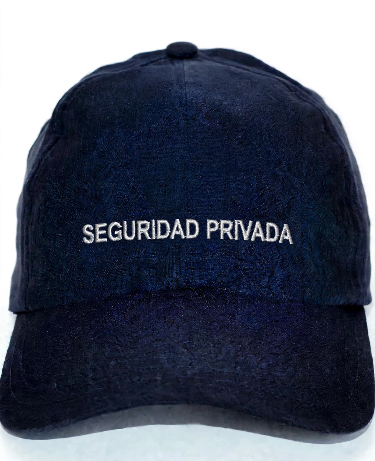Gorra azul oscuro con el texto SEGURIDAD PRIVADA bordado